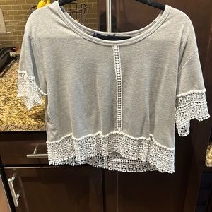 100% cotton. Grey T-shirt.